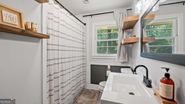 715 Wood Valley Rd, Mableton, GA 30126 - bathroom with toilet, plenty of natural light, and curtained shower