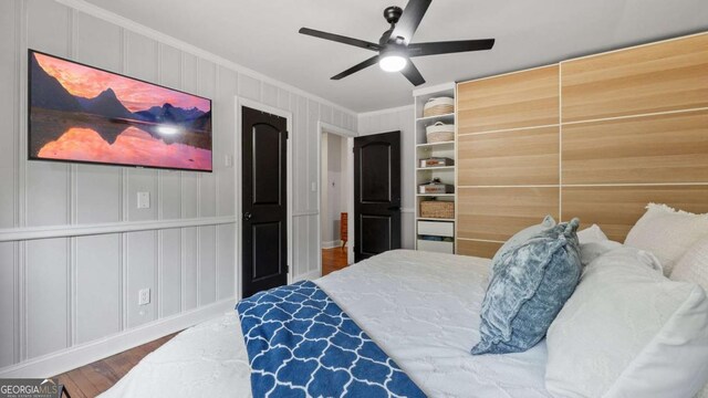 715 Wood Valley Rd, Mableton, GA 30126 - bedroom featuring crown molding, wood finished floors, a decorative wall, and ceiling fan