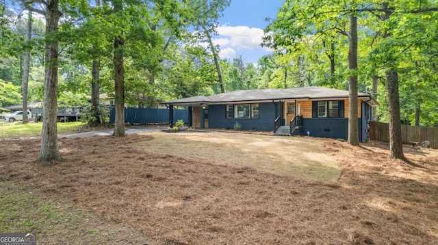 715 Wood Valley Rd, Mableton, GA 30126 - view of front of house featuring fence, entry steps, and view of wooded area