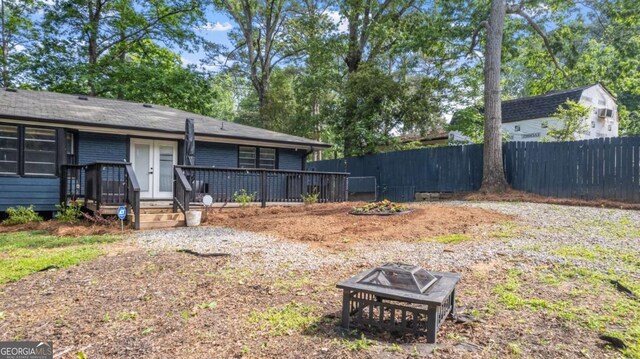 715 Wood Valley Rd, Mableton, GA 30126 - view of yard featuring a fire pit, fence, and a deck