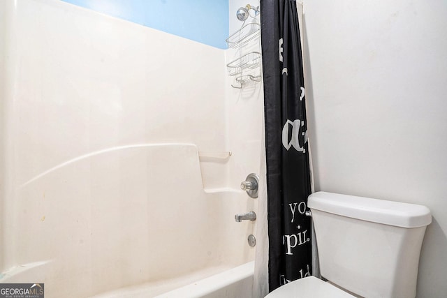 bathroom with toilet and shower / tub combo with curtain