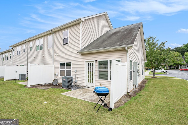 back of house featuring central air condition unit and a patio area