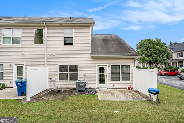 rear view of property featuring a patio and central air condition unit