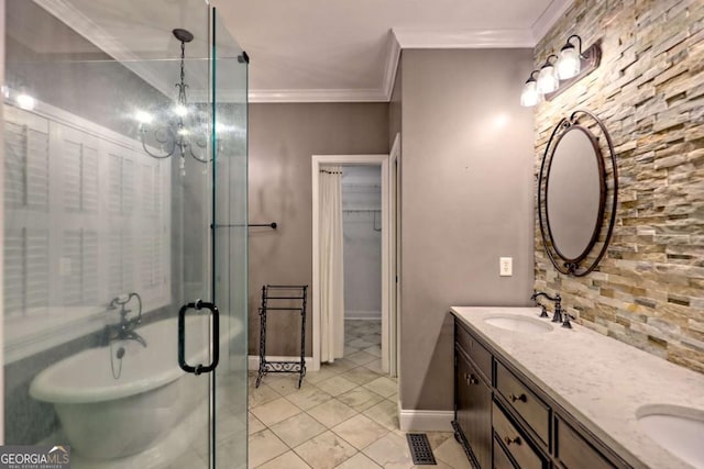 full bathroom with a sink, ornamental molding, tile patterned flooring, double vanity, and a freestanding tub