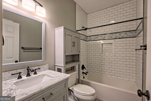bathroom featuring vanity, toilet, and washtub / shower combination
