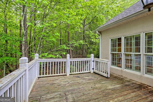deck featuring a wooded view