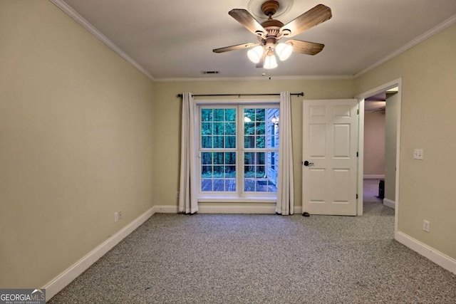 spare room with ceiling fan, baseboards, ornamental molding, and carpet floors