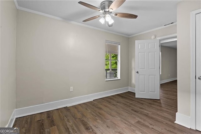 1939 Dunlap Ave, Atlanta, GA 30344 - unfurnished bedroom with crown molding, visible vents, wood finished floors, and baseboards