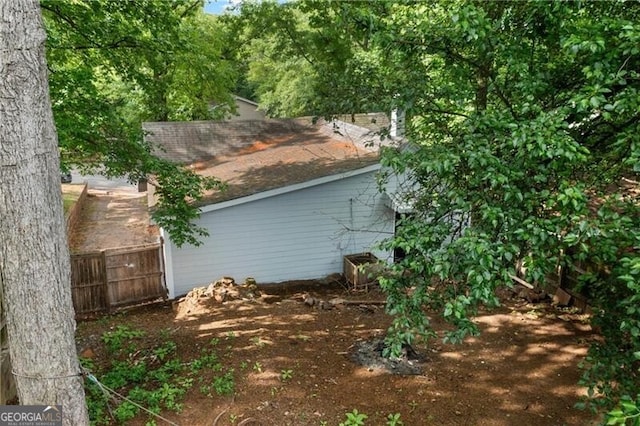 1939 Dunlap Ave, Atlanta, GA 30344 - view of home's exterior with a shingled roof and fence