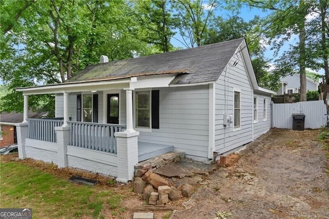 1939 Dunlap Ave, Atlanta, GA 30344 - bungalow-style house featuring a porch, roof with shingles, and fence