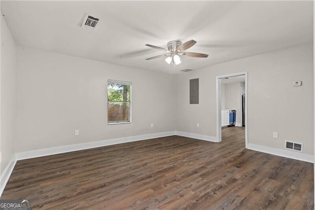1939 Dunlap Ave, Atlanta, GA 30344 - empty room with electric panel, dark wood-type flooring, visible vents, a ceiling fan, and baseboards