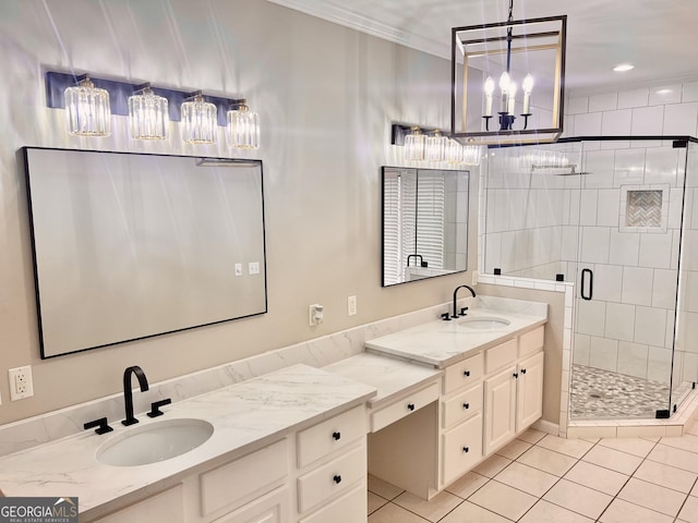 bathroom with vanity, tile patterned floors, crown molding, a shower stall, and a notable chandelier