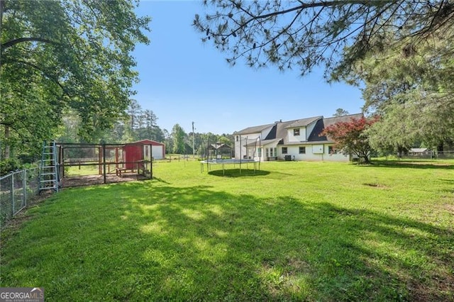 3880 Dial Mill Rd NE, Conyers, GA 30013 - view of yard featuring a trampoline, an outbuilding, and exterior structure