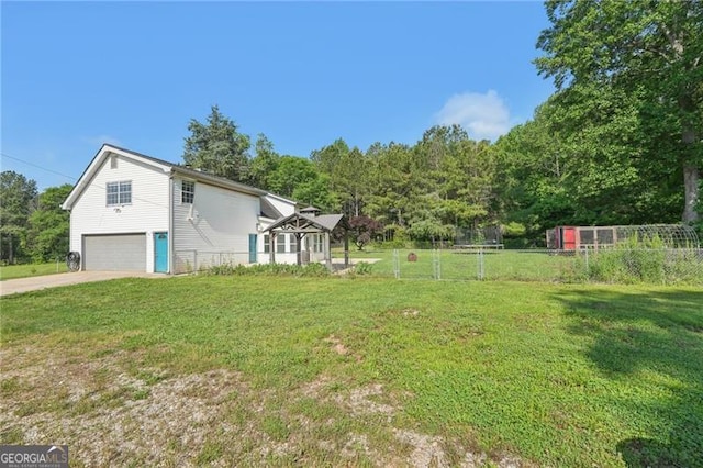 3880 Dial Mill Rd NE, Conyers, GA 30013 - view of yard with a garage and concrete driveway