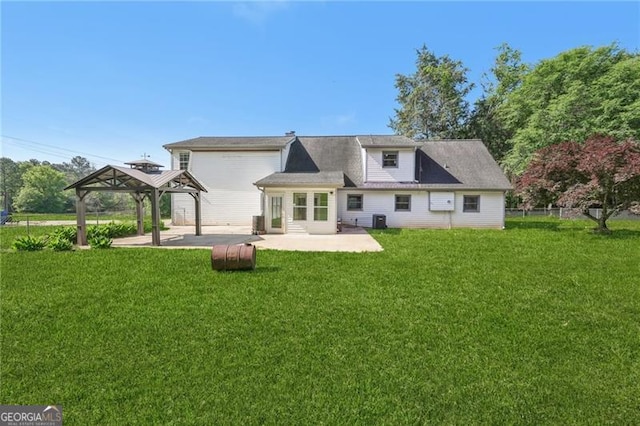 3880 Dial Mill Rd NE, Conyers, GA 30013 - back of property featuring a gazebo, a patio area, a yard, and central air condition unit
