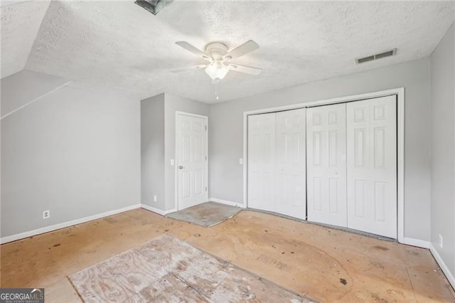 3880 Dial Mill Rd NE, Conyers, GA 30013 - unfurnished bedroom featuring baseboards, a textured ceiling, a closet, and ceiling fan