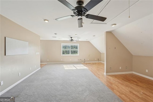 3880 Dial Mill Rd NE, Conyers, GA 30013 - bonus room featuring ceiling fan, baseboards, lofted ceiling, light wood-type flooring, and light carpet