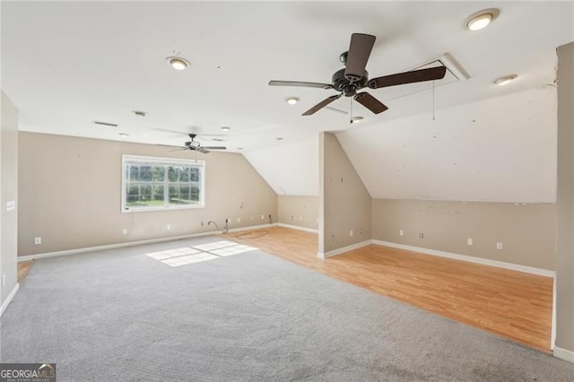 3880 Dial Mill Rd NE, Conyers, GA 30013 - additional living space featuring ceiling fan, attic access, light colored carpet, baseboards, and vaulted ceiling