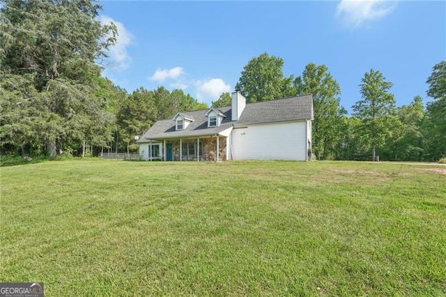 3880 Dial Mill Rd NE, Conyers, GA 30013 - back of property featuring a lawn, a chimney, and a garage