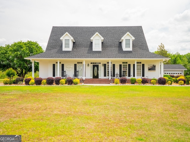 view of front of property featuring a porch, a shingled roof, and a front lawn