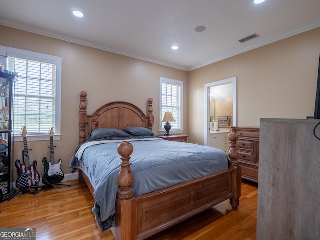 bedroom with crown molding, recessed lighting, multiple windows, and light wood-style floors