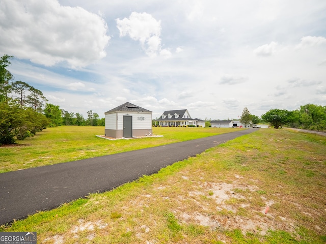 view of road with driveway