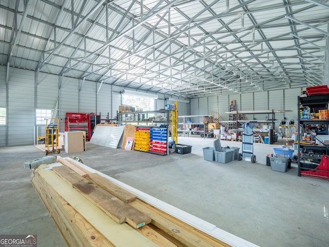garage with a workshop area and metal wall