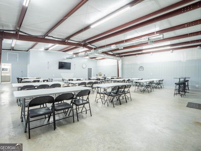 dining space with concrete flooring