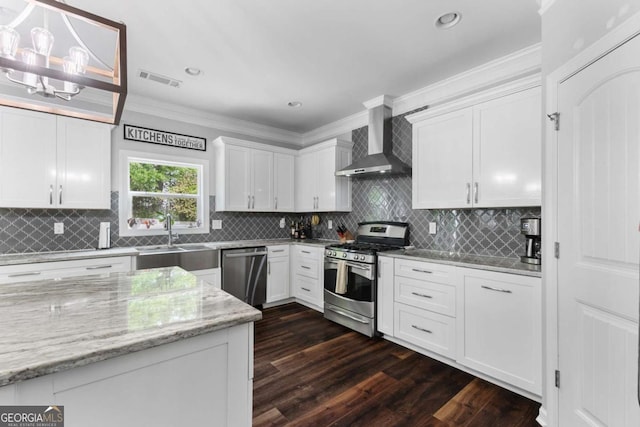 3016 Levinshire Way, Dacula, GA 30019 - kitchen featuring a sink, wall chimney exhaust hood, white cabinets, crown molding, and appliances with stainless steel finishes