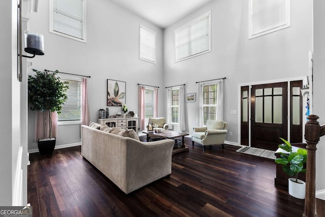 3016 Levinshire Way, Dacula, GA 30019 - living area featuring dark wood finished floors, baseboards, and a high ceiling