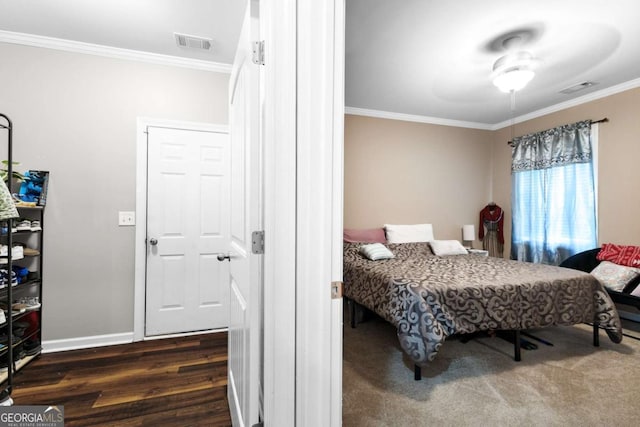 3016 Levinshire Way, Dacula, GA 30019 - bedroom featuring crown molding, dark wood finished floors, visible vents, and baseboards