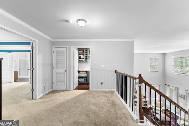 3016 Levinshire Way, Dacula, GA 30019 - corridor featuring baseboards, ornamental molding, an upstairs landing, and carpet floors