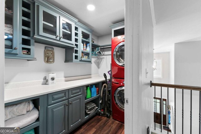 3016 Levinshire Way, Dacula, GA 30019 - clothes washing area with stacked washer and clothes dryer, laundry area, and dark wood-style floors