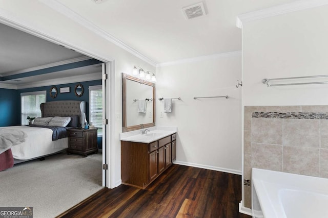 3016 Levinshire Way, Dacula, GA 30019 - ensuite bathroom featuring a bathtub, visible vents, connected bathroom, crown molding, and wood finished floors