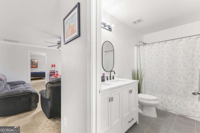 3016 Levinshire Way, Dacula, GA 30019 - bathroom with toilet, vanity, ensuite bath, tile patterned floors, and ceiling fan