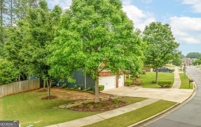 3016 Levinshire Way, Dacula, GA 30019 - view of front facade with fence, a garage, a front lawn, and concrete driveway