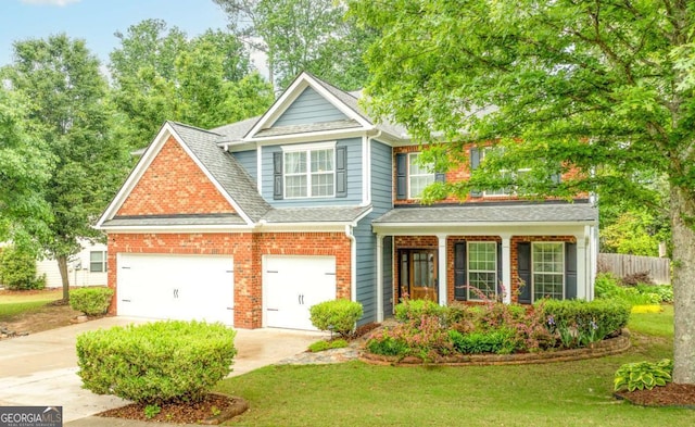 3016 Levinshire Way, Dacula, GA 30019 - view of front of house with fence, a front lawn, roof with shingles, brick siding, and driveway
