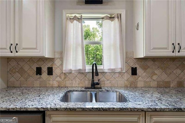 42 Treemont Dr SE, Cartersville, GA 30121 - kitchen with light stone countertops, white cabinets, and backsplash