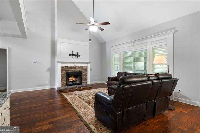 42 Treemont Dr SE, Cartersville, GA 30121 - living area featuring ceiling fan, dark wood finished floors, high vaulted ceiling, and a stone fireplace