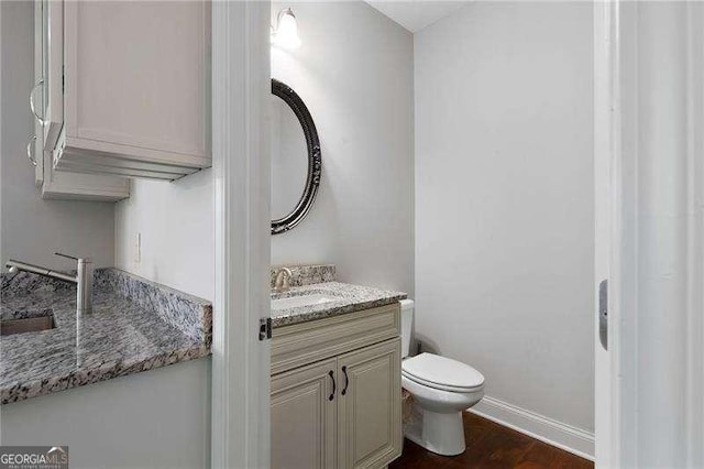 42 Treemont Dr SE, Cartersville, GA 30121 - half bathroom featuring vanity and wood finished floors