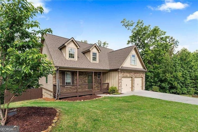 42 Treemont Dr SE, Cartersville, GA 30121 - view of front of home featuring covered porch, driveway, stone siding, a garage, and roof with shingles