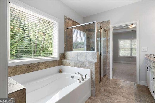 42 Treemont Dr SE, Cartersville, GA 30121 - full bathroom with vanity, a bath, and a shower stall