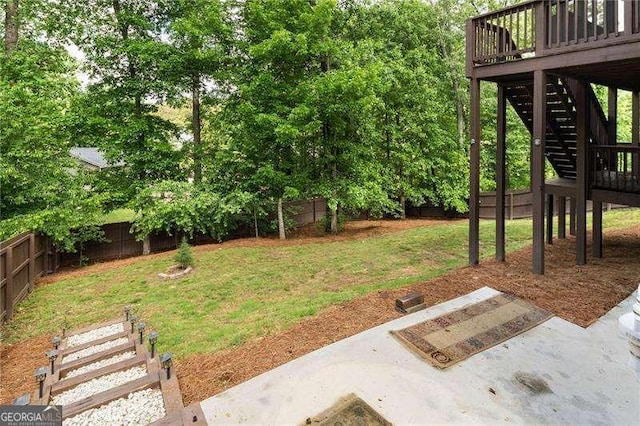 42 Treemont Dr SE, Cartersville, GA 30121 - fenced backyard with stairway and a deck