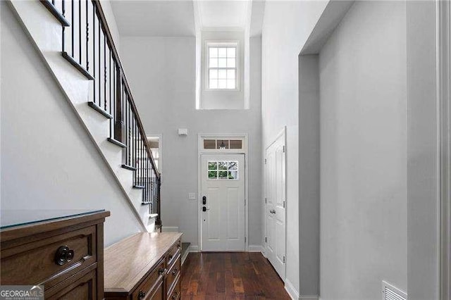 42 Treemont Dr SE, Cartersville, GA 30121 - foyer entrance featuring dark wood-style flooring, stairs, and a towering ceiling