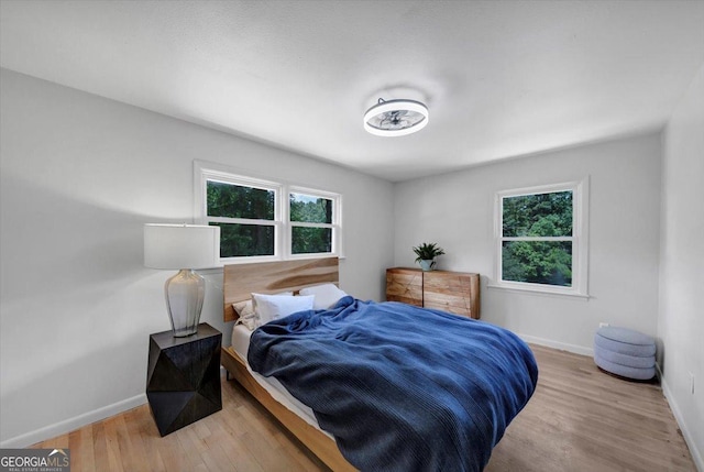 3807 Greenhill Dr, Chamblee, GA 30341 - bedroom with multiple windows and wood finished floors