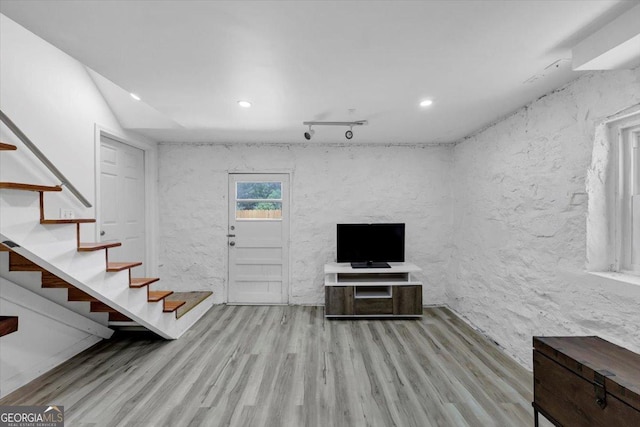 3807 Greenhill Dr, Chamblee, GA 30341 - unfurnished living room with wood finished floors, stairway, recessed lighting, and a textured wall