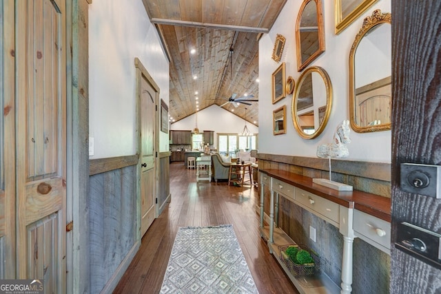 corridor featuring dark wood finished floors, wood ceiling, and vaulted ceiling
