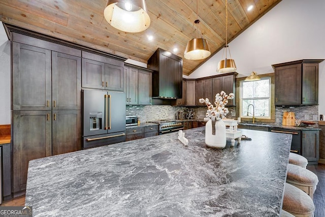 kitchen featuring wooden ceiling, premium appliances, dark brown cabinetry, wood finished floors, and tasteful backsplash