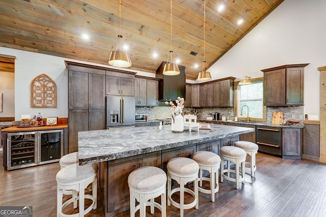 kitchen with stone counters, high quality fridge, wood ceiling, dark wood-type flooring, and decorative backsplash