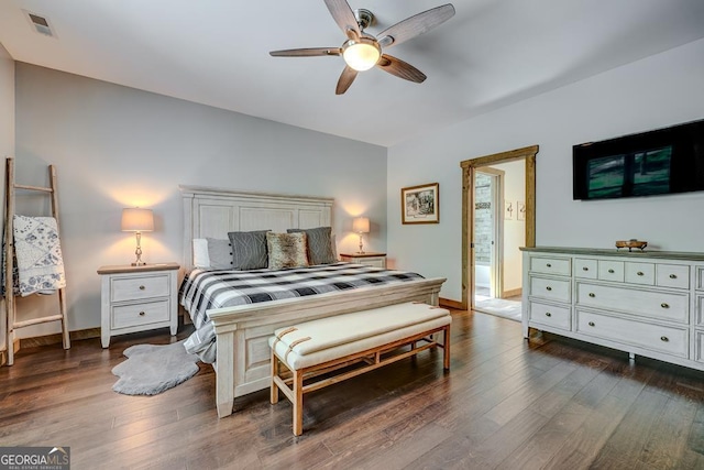 bedroom featuring visible vents, dark wood-style flooring, baseboards, and ceiling fan
